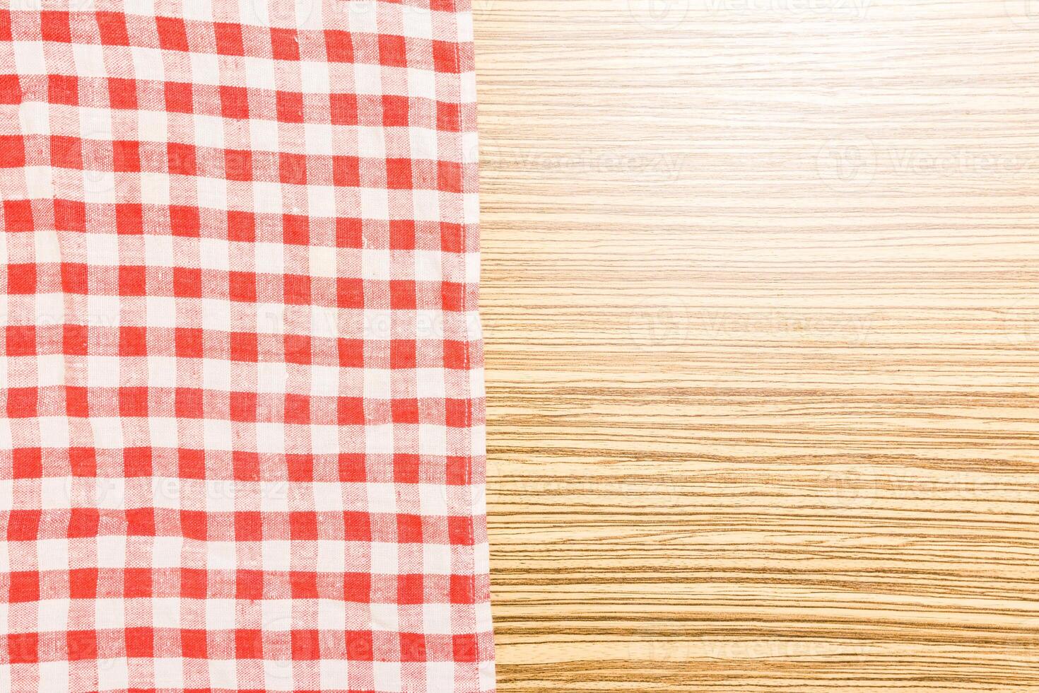 the checkered tablecloth on wooden table photo