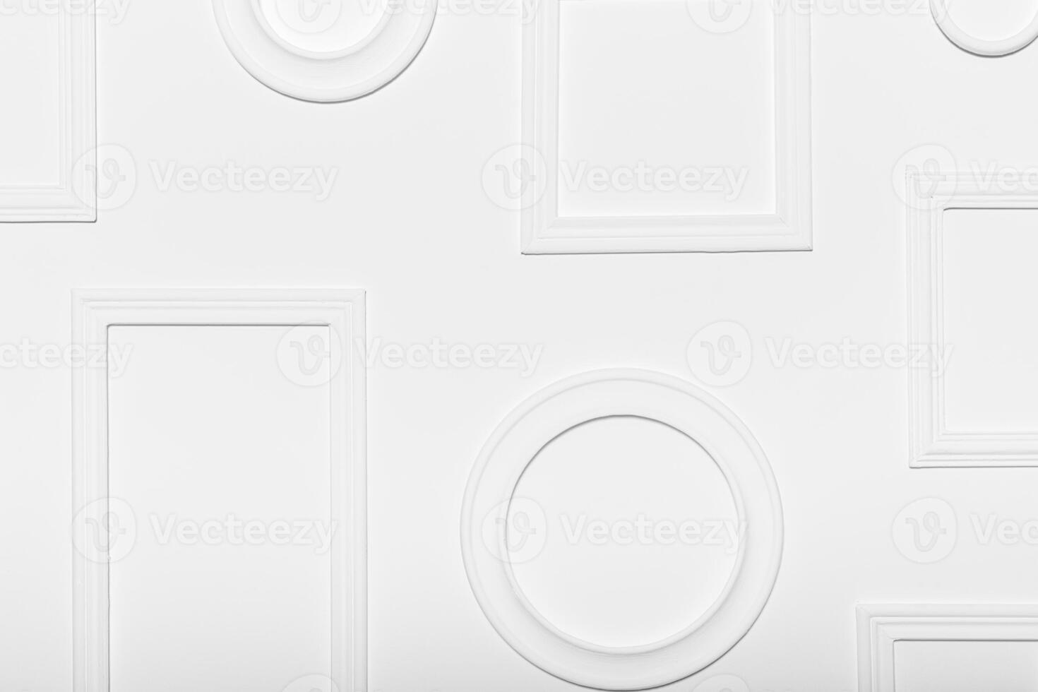 White wall with various empty frames ready for artwork display at an art gallery or exhibit photo