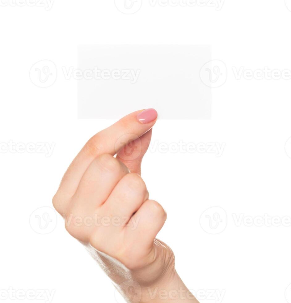 Hand holding a blank card against a white background in a close-up shot capturing the gesture of offering or presenting photo
