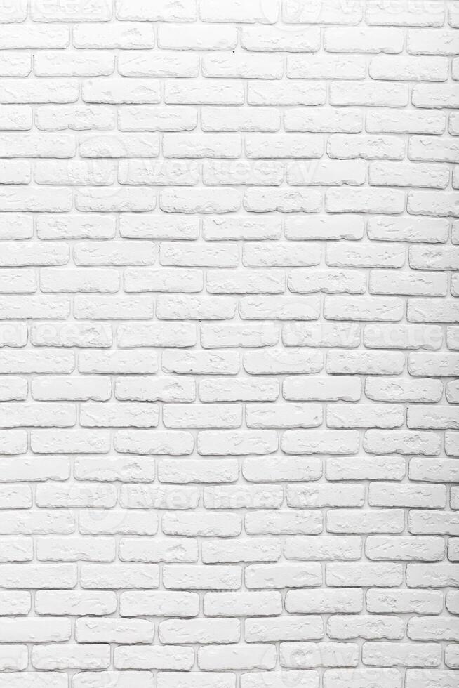 Textured white brick wall provides a clean background for creative designs and modern decor in various settings photo
