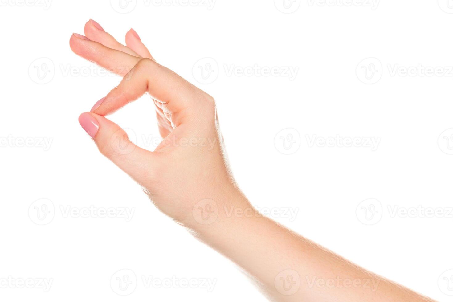 Hand gesture demonstrating the OK sign against a plain white background emphasizing communication and expression photo