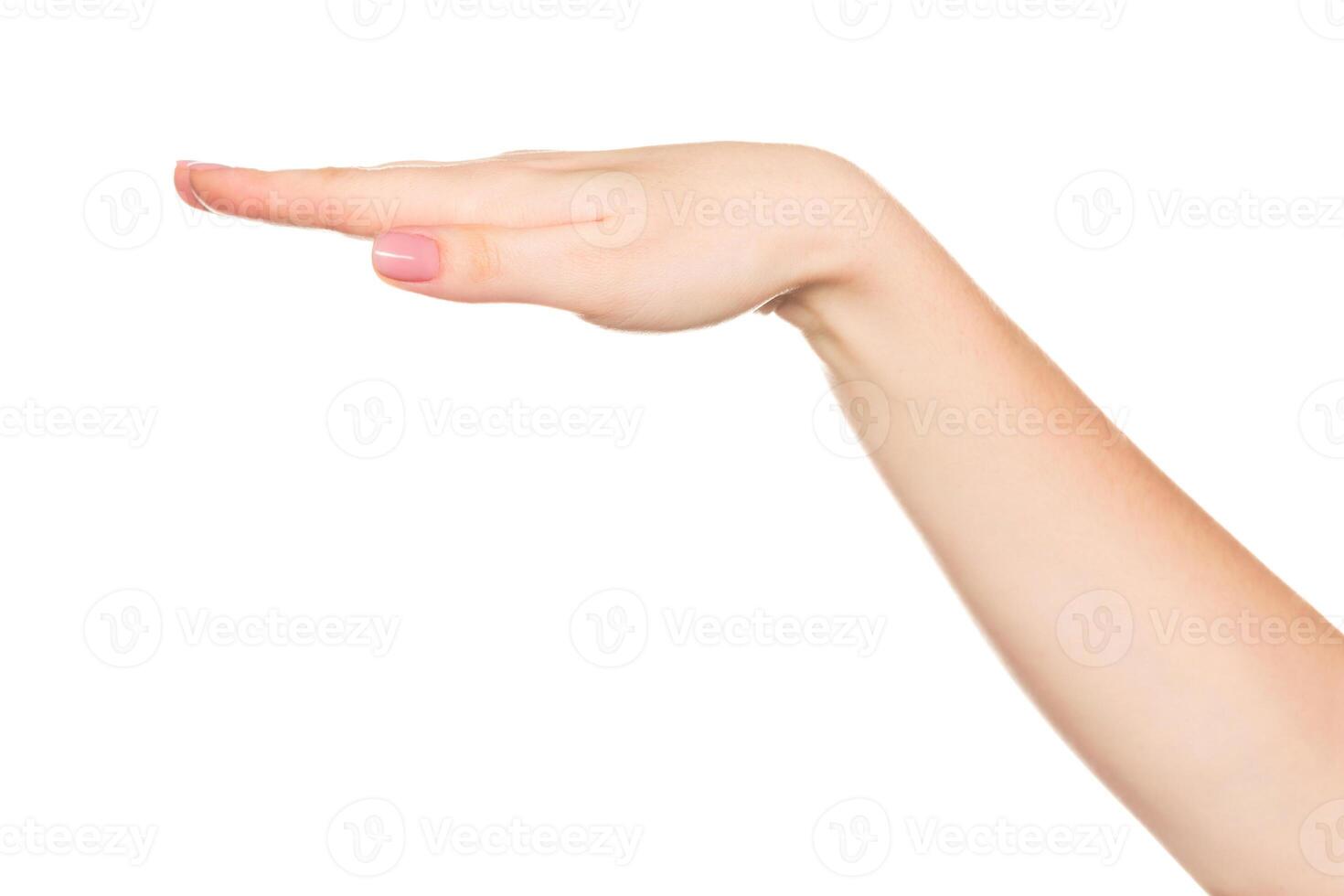 Hand gesture demonstrating a flat surface or level position in a neutral background setting photo