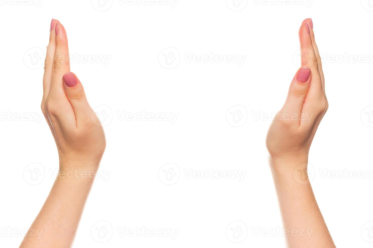Hands positioned outward in a gesture of welcome or invitation in a minimalist setting photo