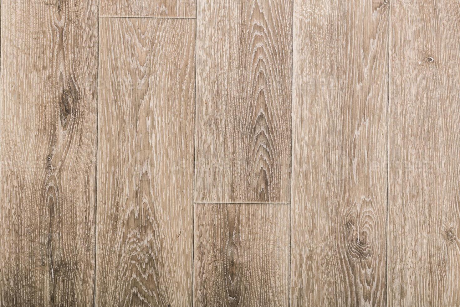 Wooden floor surface with natural grain patterns captured in well-lit indoor setting photo