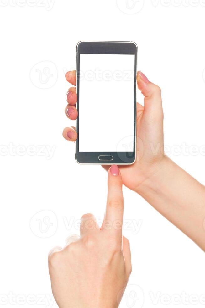 Hand holding smartphone with a blank screen in a bright setting during daytime photo