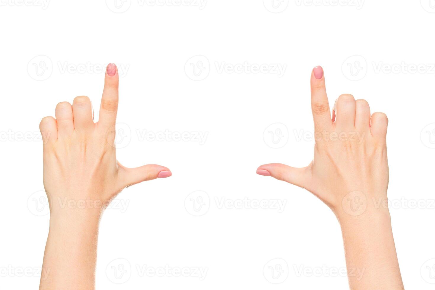Hands forming a rectangular frame to signify focusing on a subject indoors during daytime photo