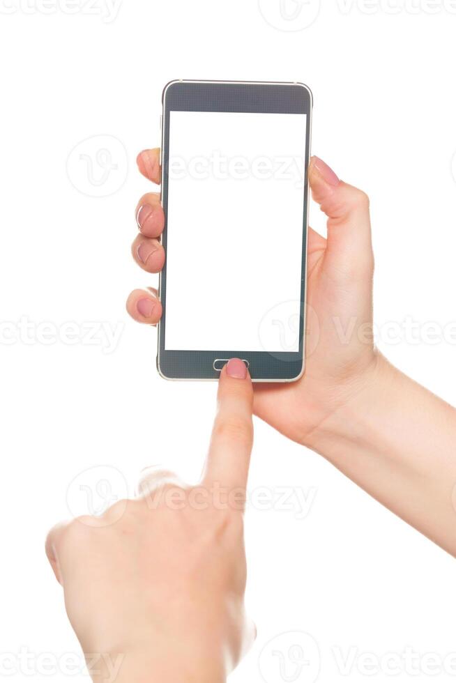 Person using a smartphone with a blank screen against a white background while touching the home button photo