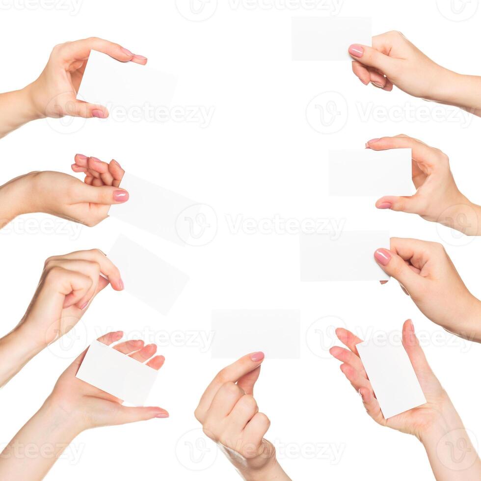 Hands presenting blank cards against a plain white background in a creative display of ideas and collaboration photo
