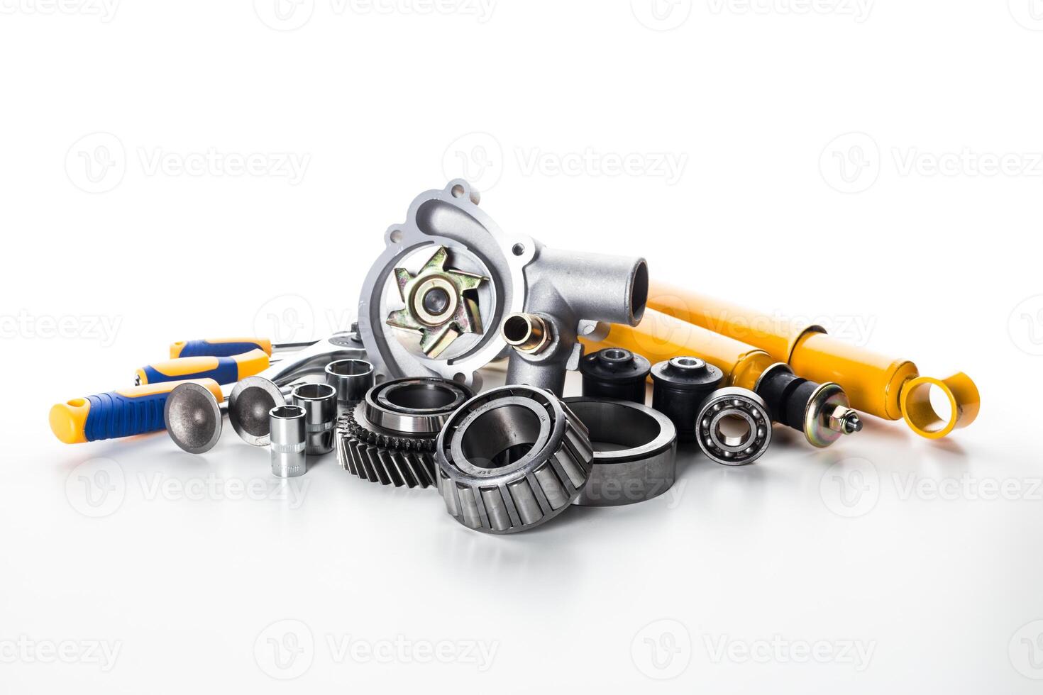 Collection of automotive parts on white background for car maintenance and repair projects photo