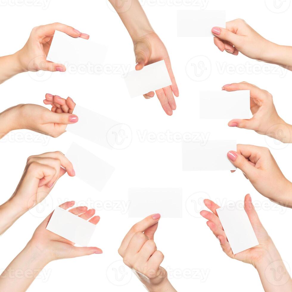Many hands hold blank business cards in a collaborative workspace during a networking event photo