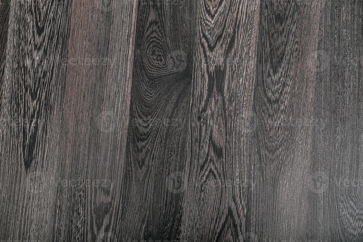 Dark wood texture with intricate grain patterns in a close-up view showcasing natural beauty and elegance photo