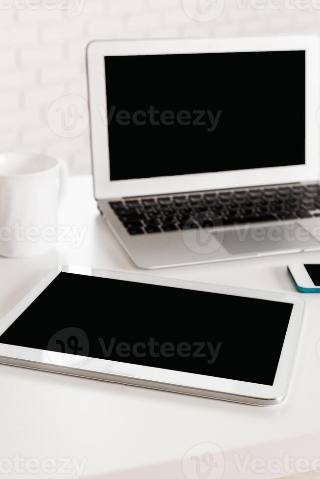 Modern workspace with digital devices showcasing productivity and organization in a minimalist setting photo