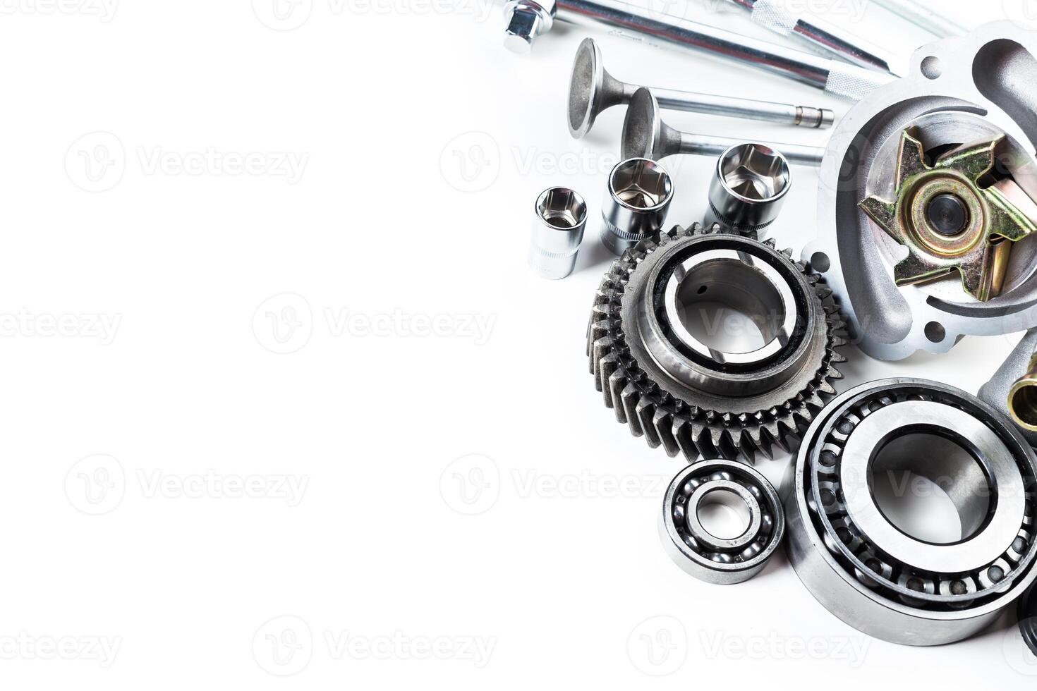 Detailed collection of mechanical components arranged artistically on a neutral background photo