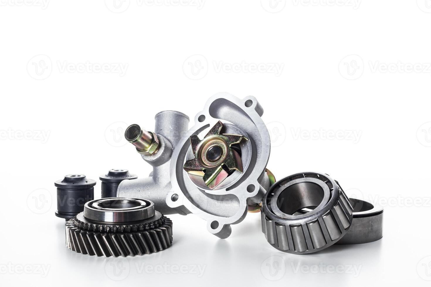 Various mechanical components arranged on a white background highlighting their intricate designs and features photo