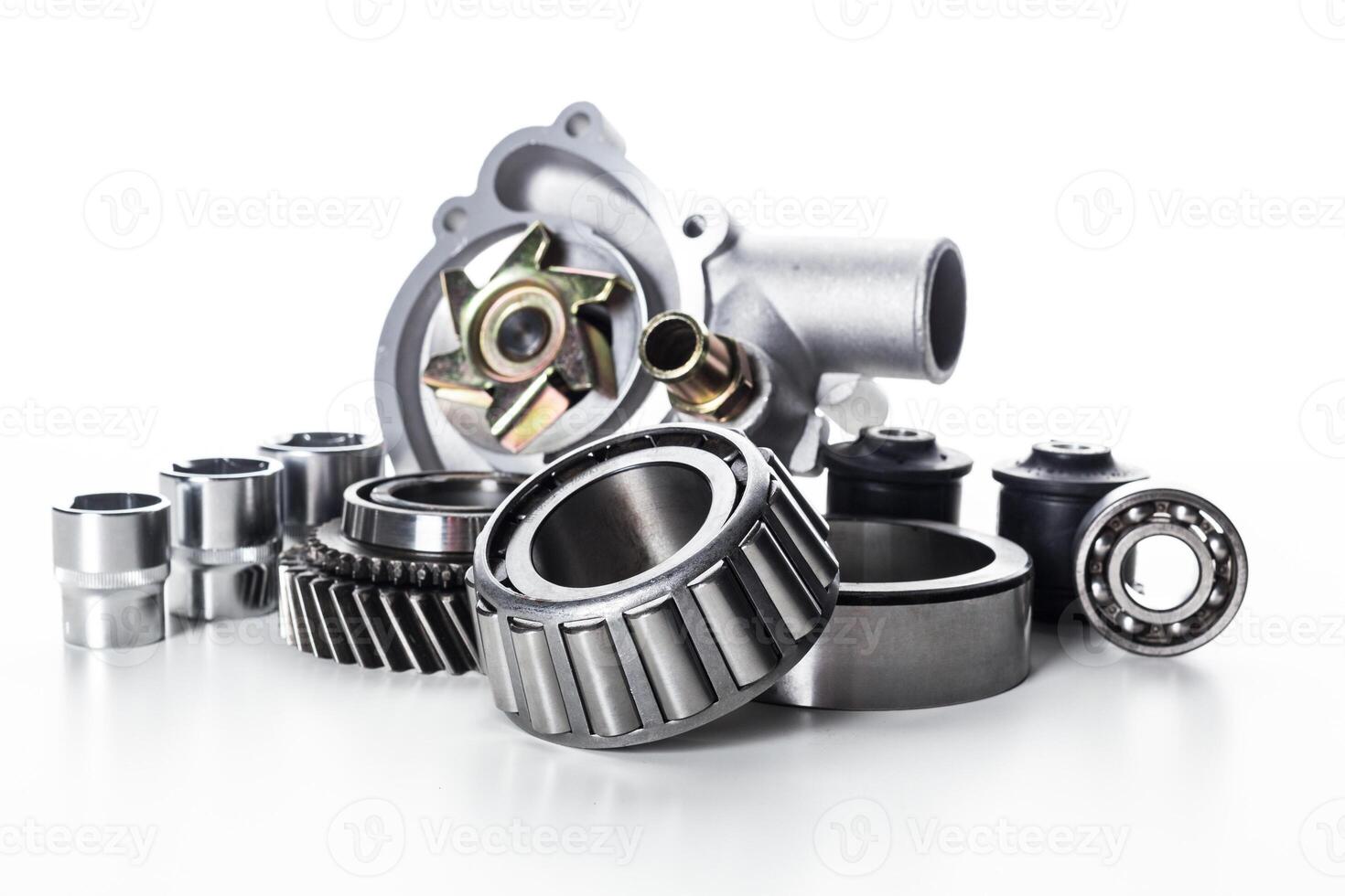 Collection of various mechanical parts and components arranged for display in a clean, bright setting photo