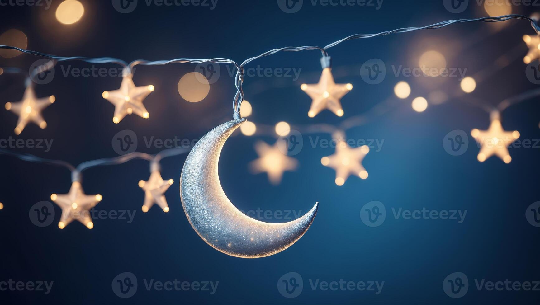 Decorative string lights with crescent moon and star design illuminate a night sky backdrop photo