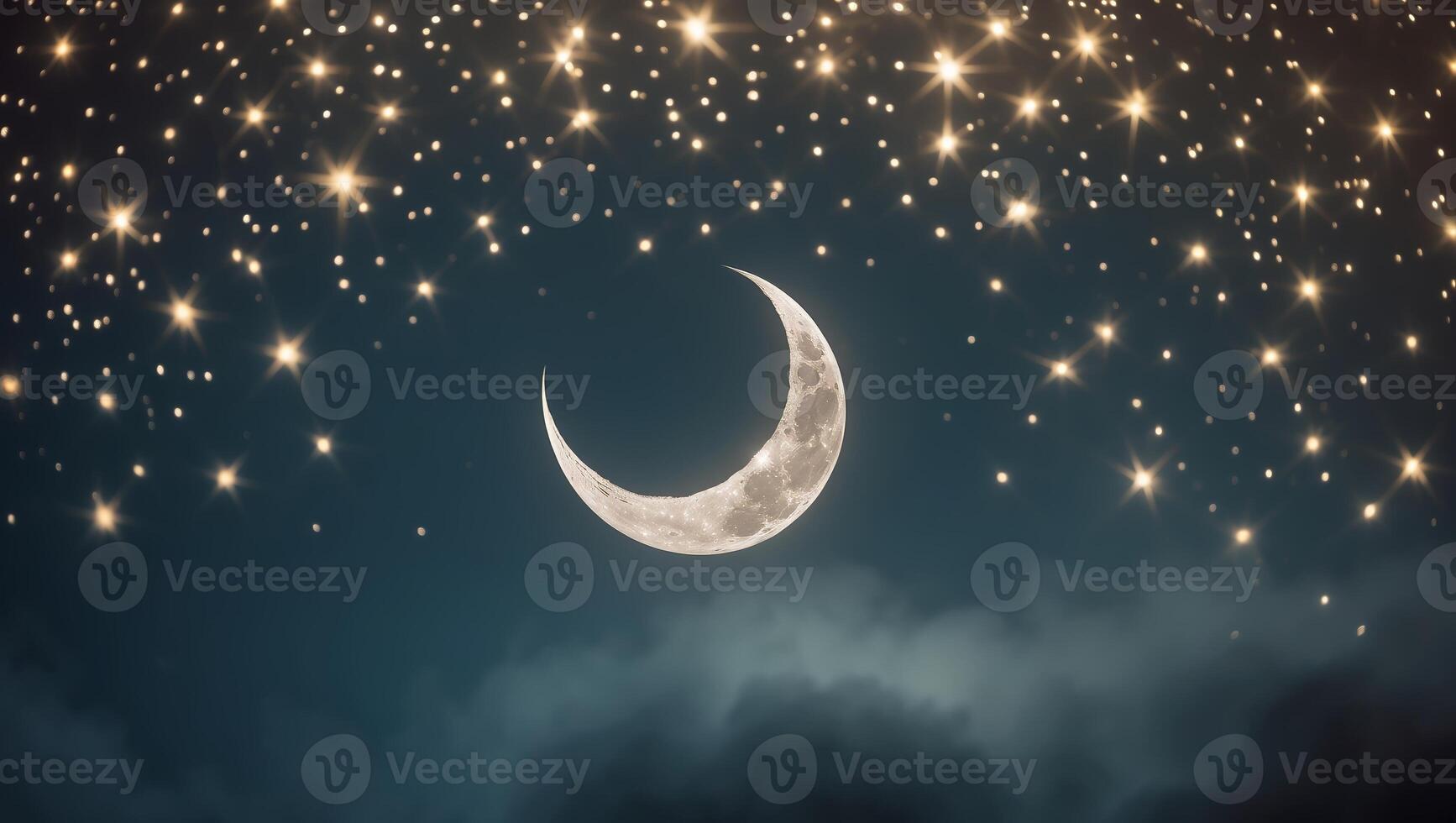 Beautiful crescent moon surrounded by twinkling stars in a night sky photo