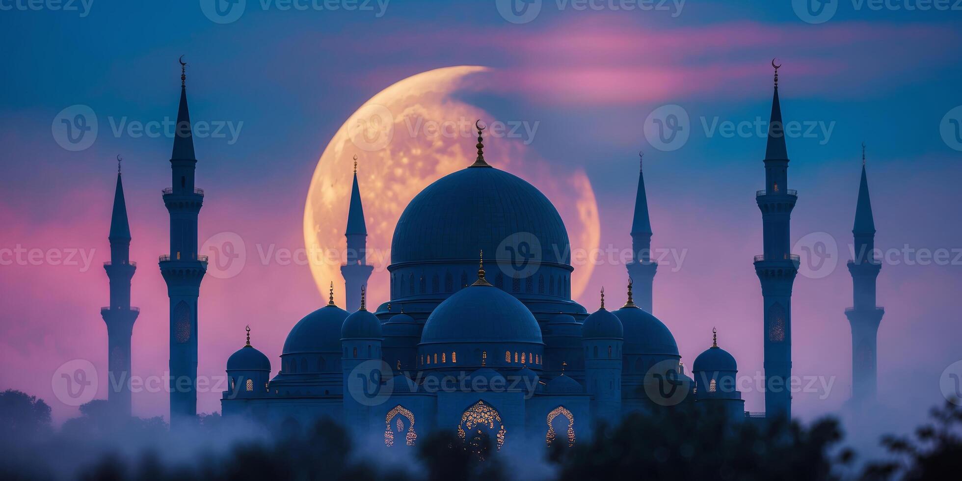 Majestic mosque silhouette against a large moonrise in a twilight sky photo