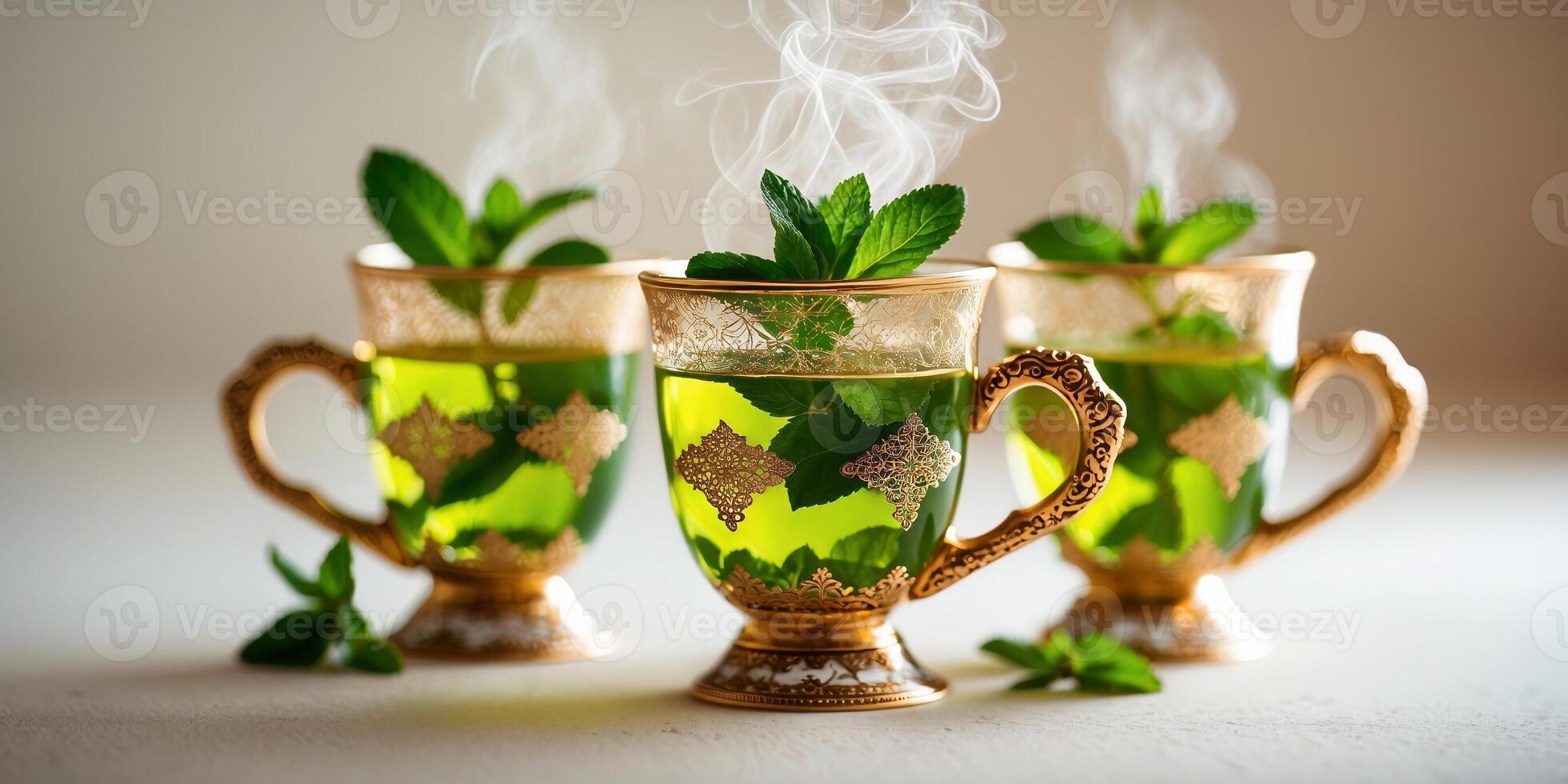 Refreshing mint tea served in ornate cups with steam rising in a cozy setting photo