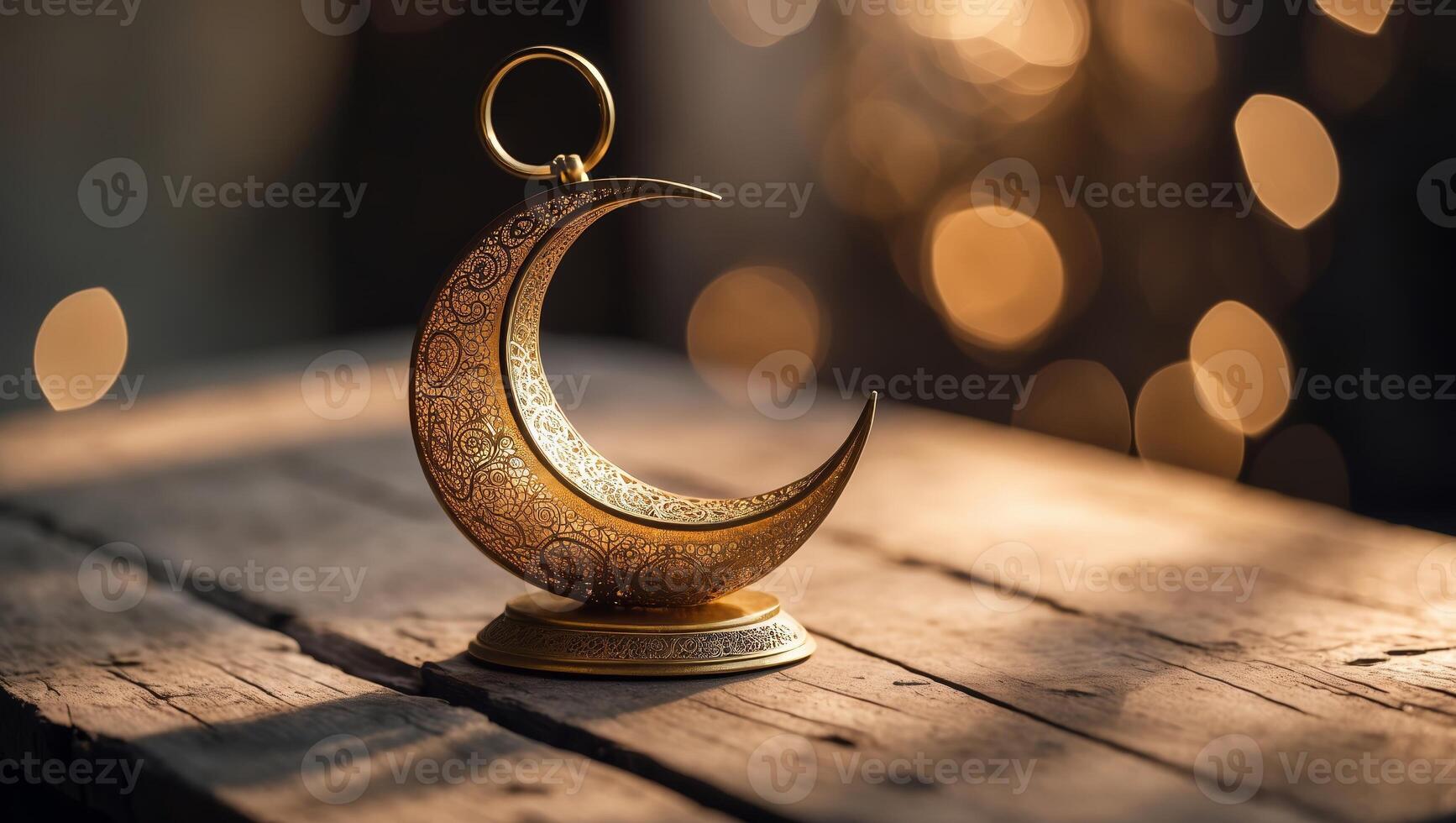 Crescent moon ornament illuminated by soft lights on a rustic wooden table at night photo