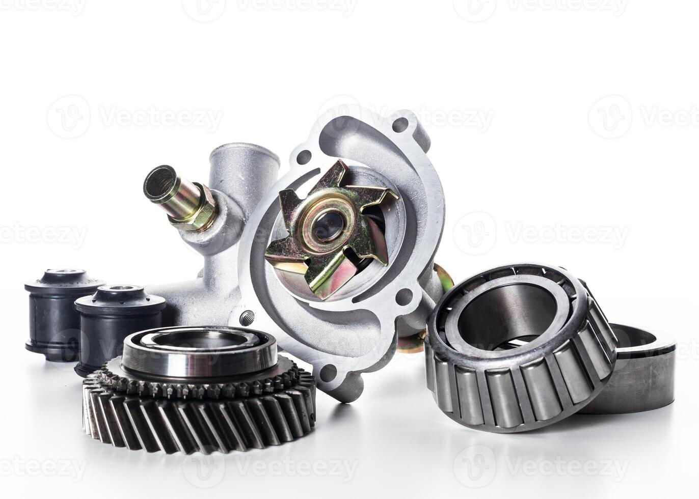 Various automotive parts showcased for inspection on a white background highlighting their details and intricate designs photo