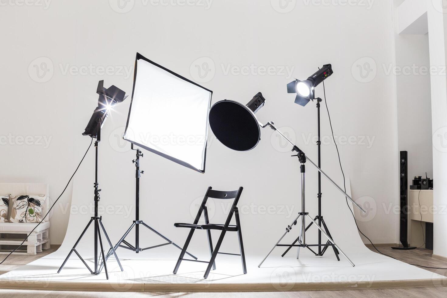 Photography studio setup with lights and equipment for a professional shoot in a minimalist space photo