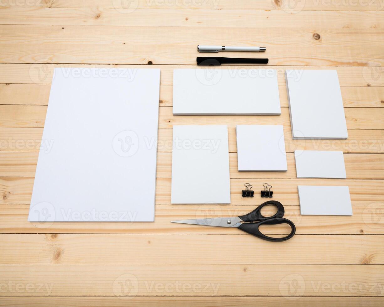 Stationery supplies arranged on a wooden table for a creative project in a well-lit workspace photo