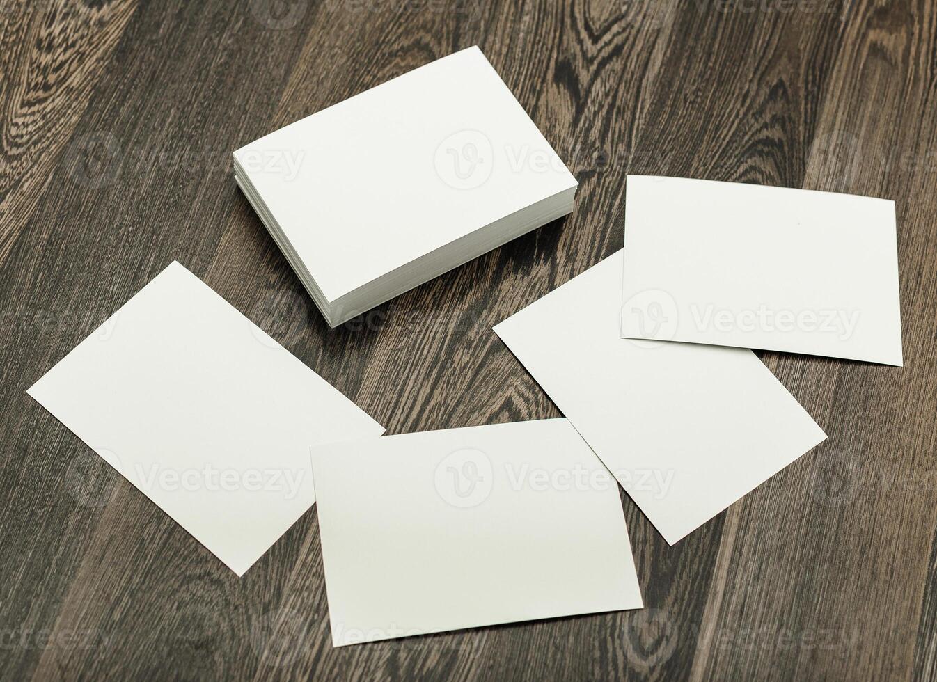 Blank cards and a stack on a wooden surface ready for creative projects or personalized messages photo