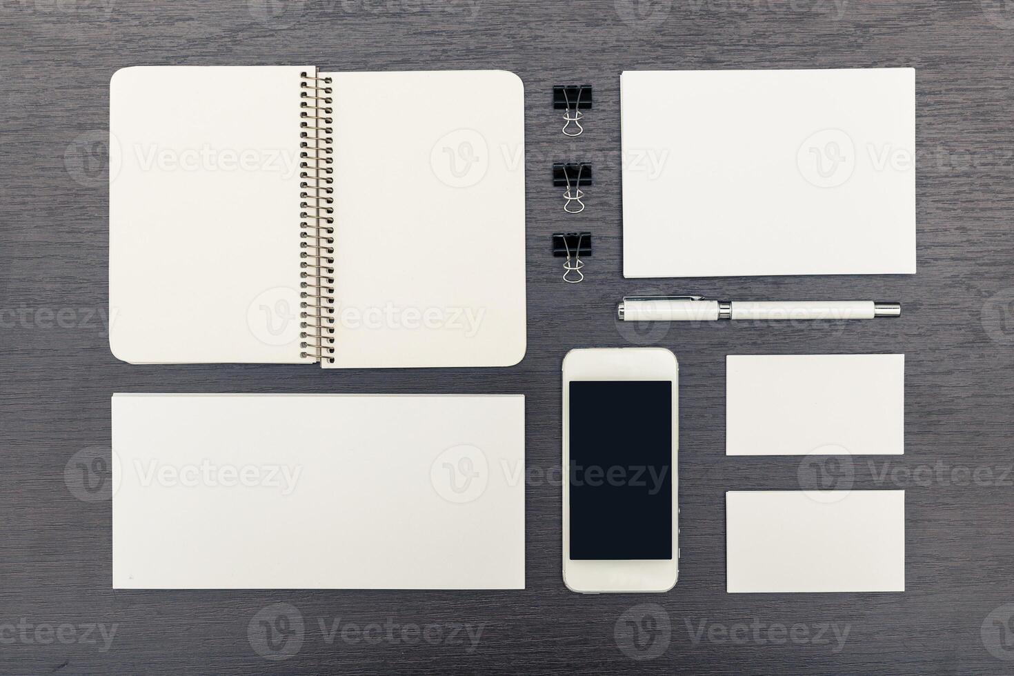 Workspace setup with blank stationery and a smartphone ready for organization and creativity photo
