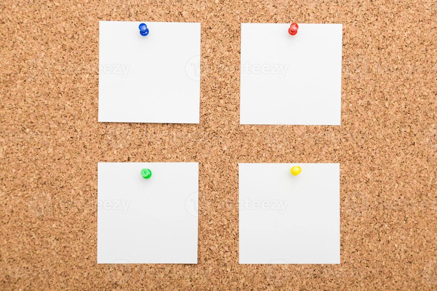 Blank notice board with colorful pushpins ready for reminders and notes photo