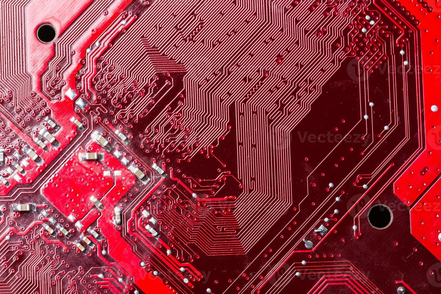 Close up of a printed red computer circuit board photo