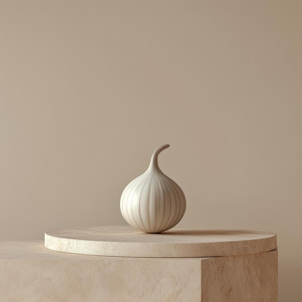 A white onion sits on a pedestal in front of a beige wall photo