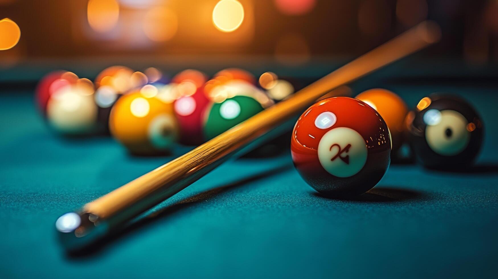 Billiard table with pool balls and cue stick photo
