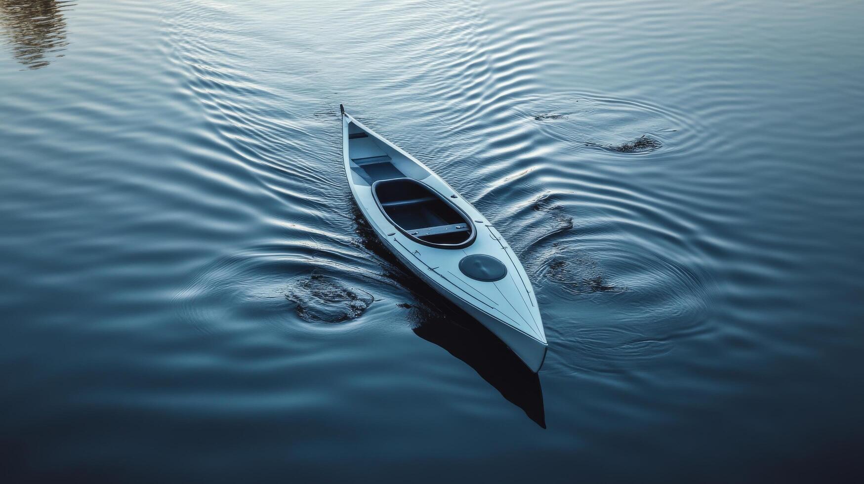 A canoe is floating on the water photo