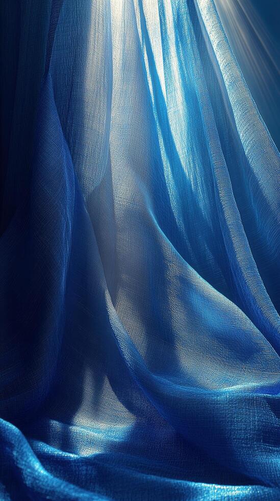A blue curtain with light coming through it photo