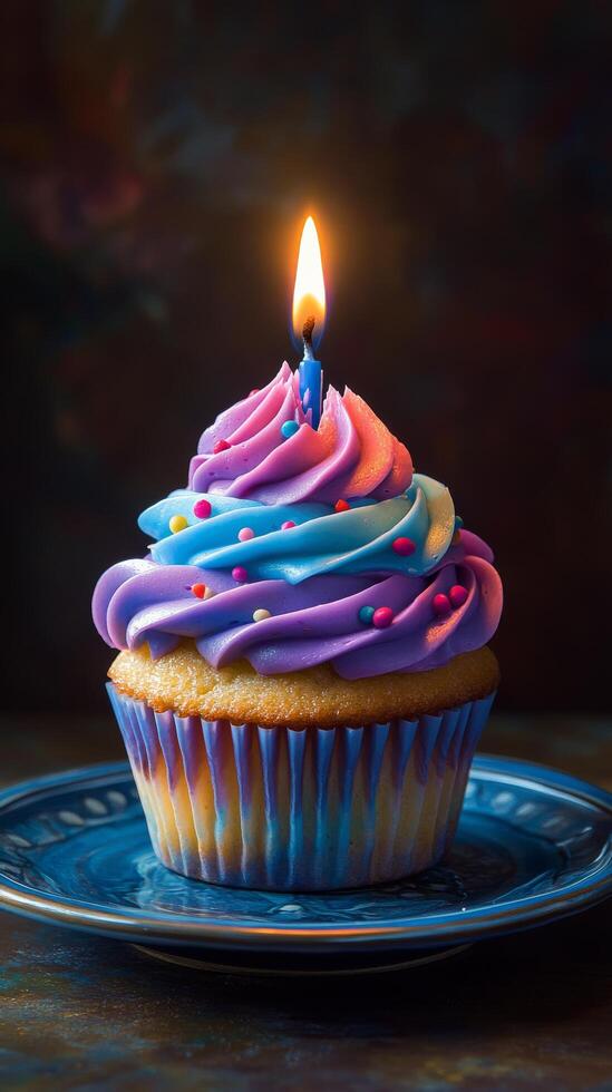 A cupcake with a lit candle on top photo