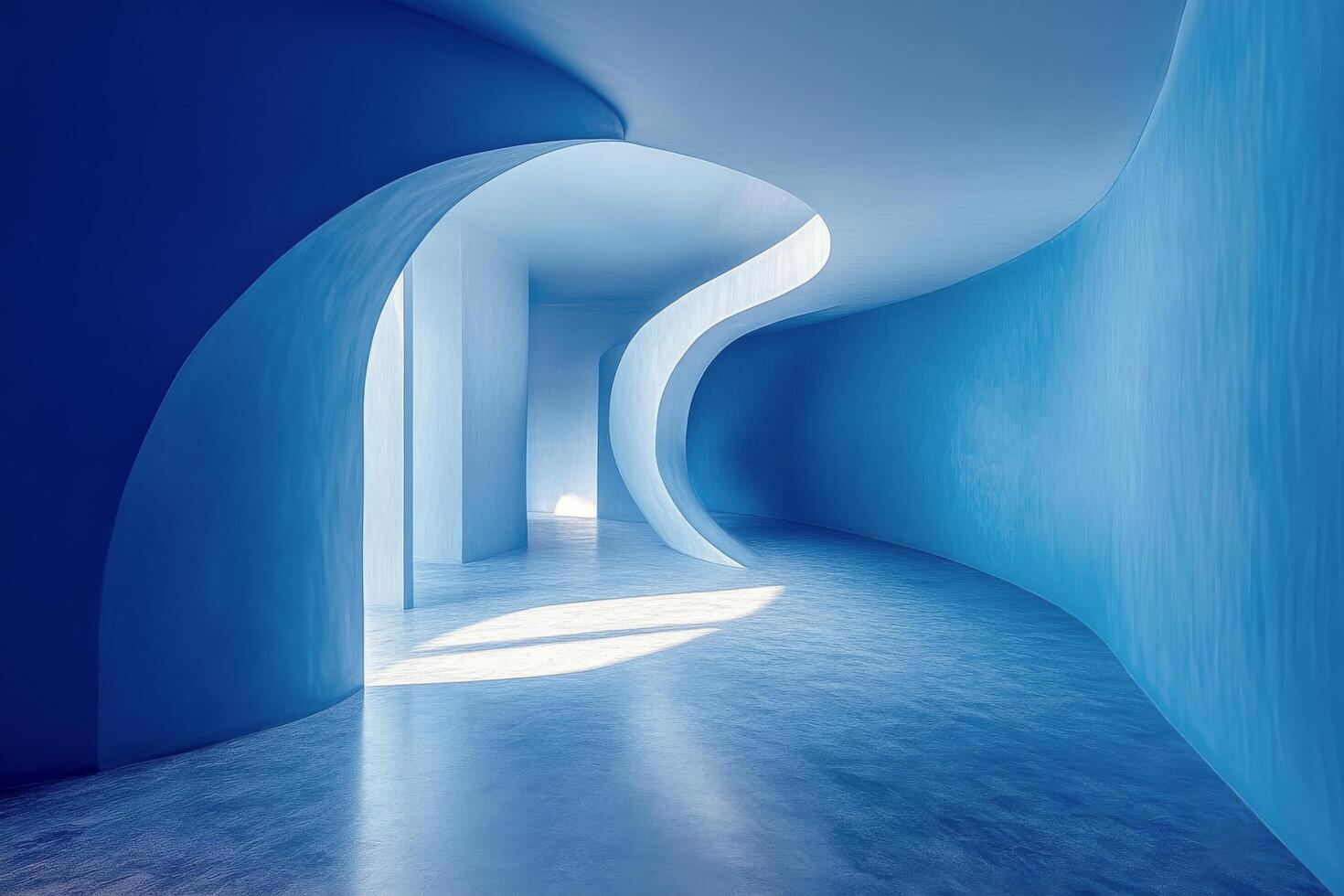 A blue room with curved walls and a light coming from the ceiling photo