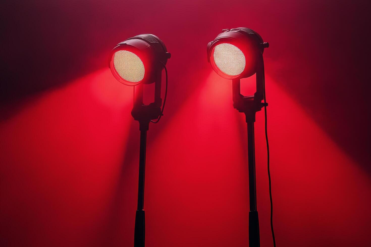 Two red spotlights on a black background photo