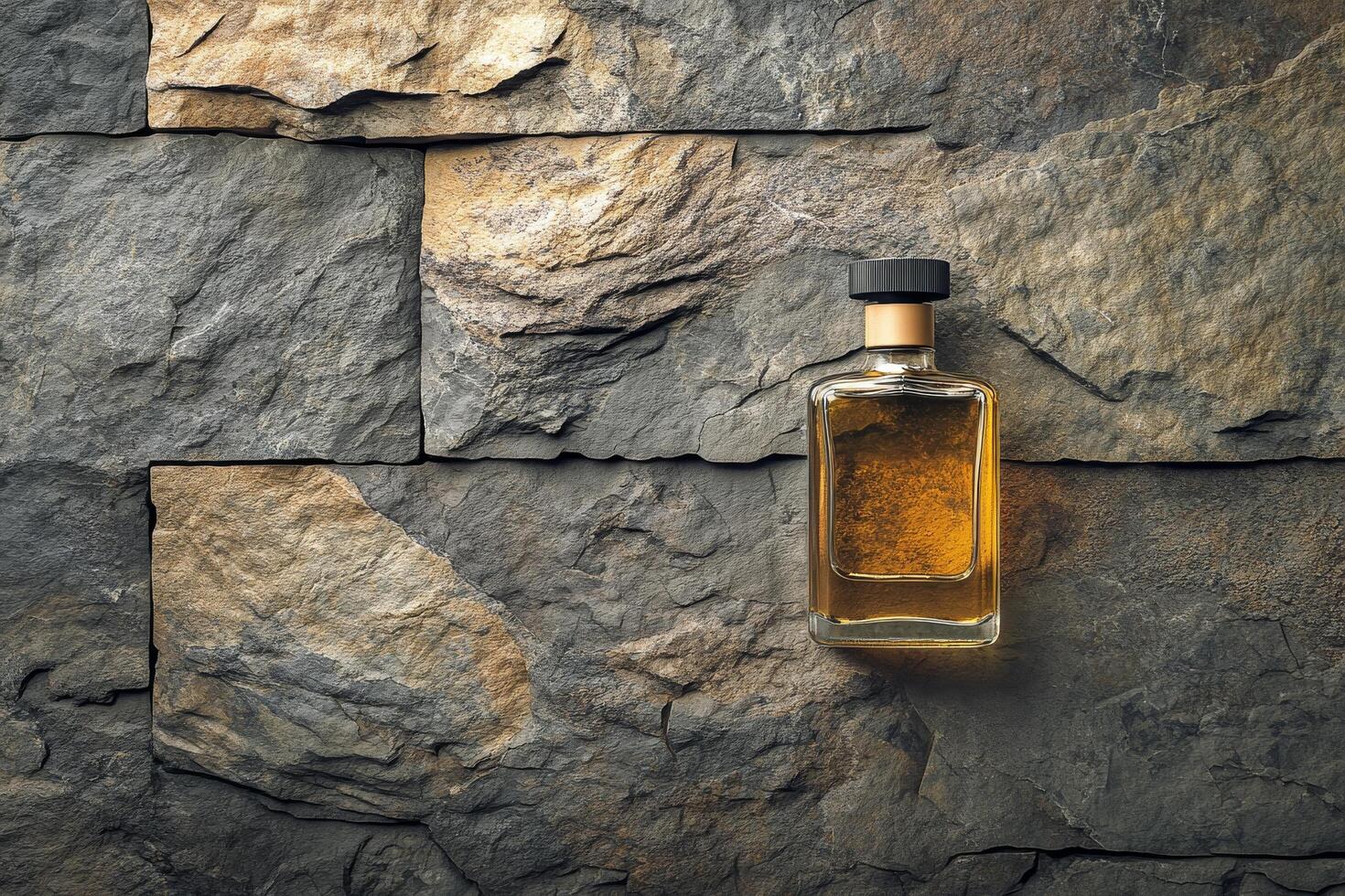 A bottle of whiskey on a stone wall photo