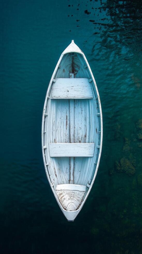 An empty boat floating in the water photo
