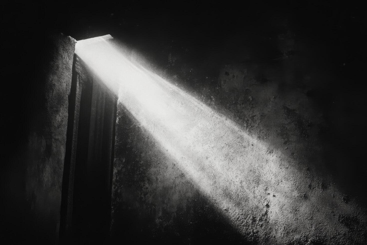 Light shining through a door in an old building photo