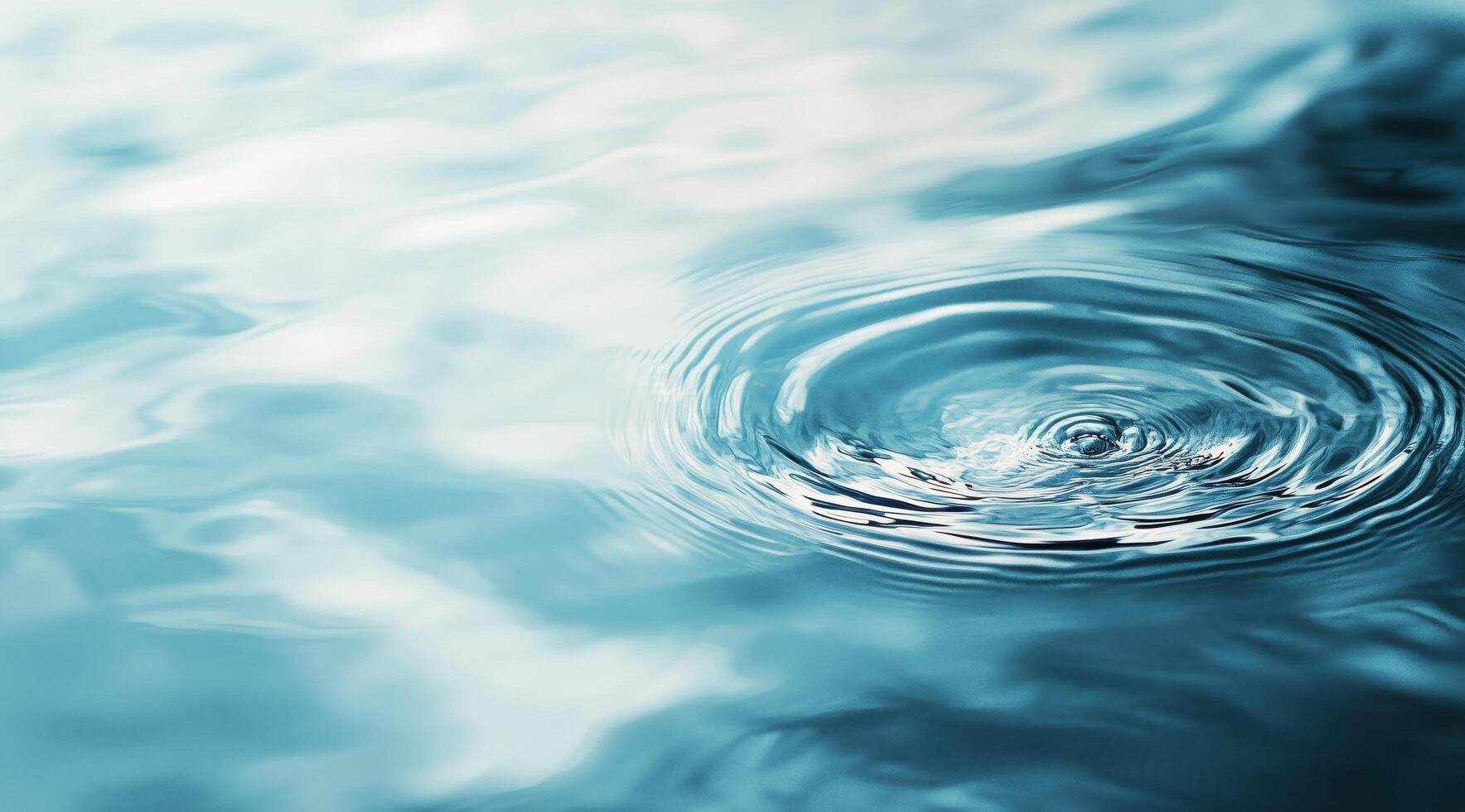 Water ripples create patterns on a calm surface under soft light in a serene setting photo