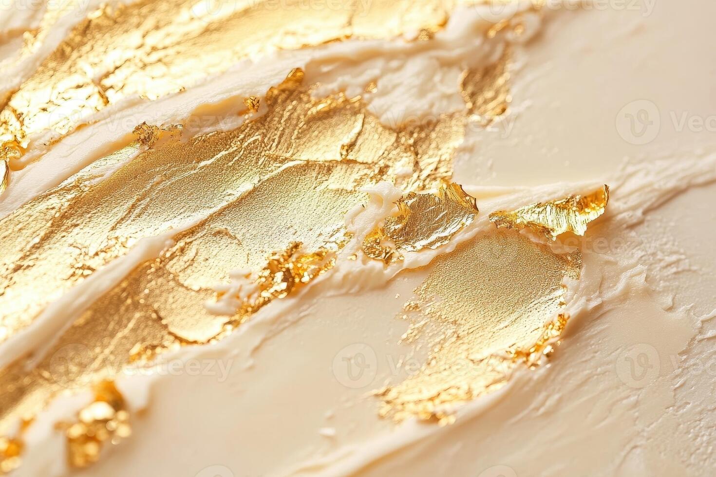 Creamy background enhanced with streaks of genuine gold leaf photo