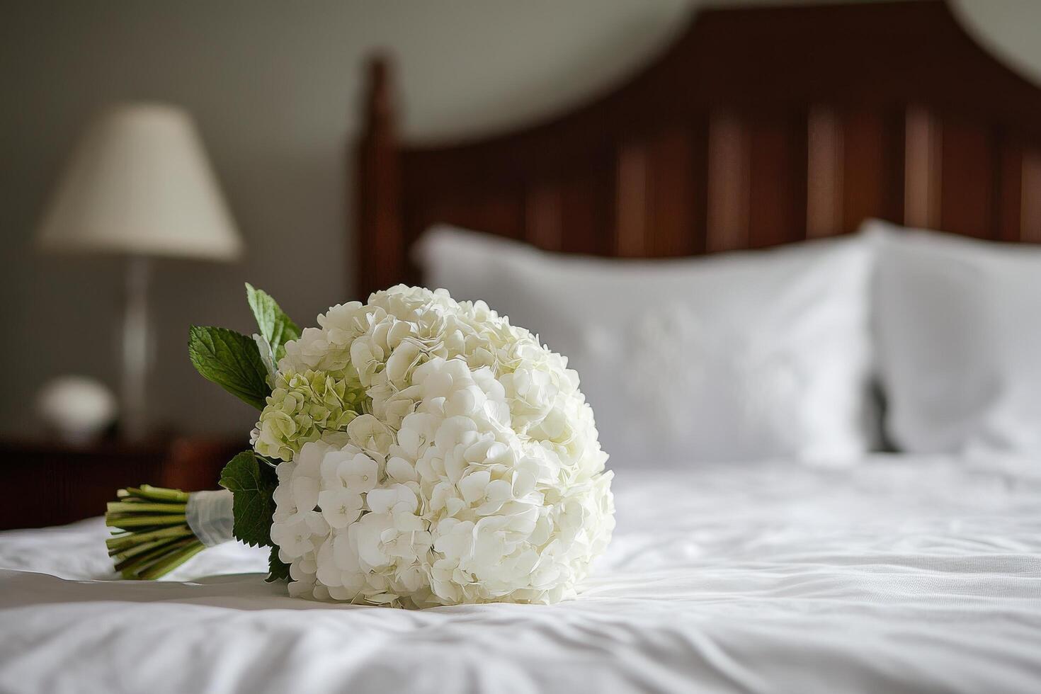 A bouquet of white flowers on a bed photo