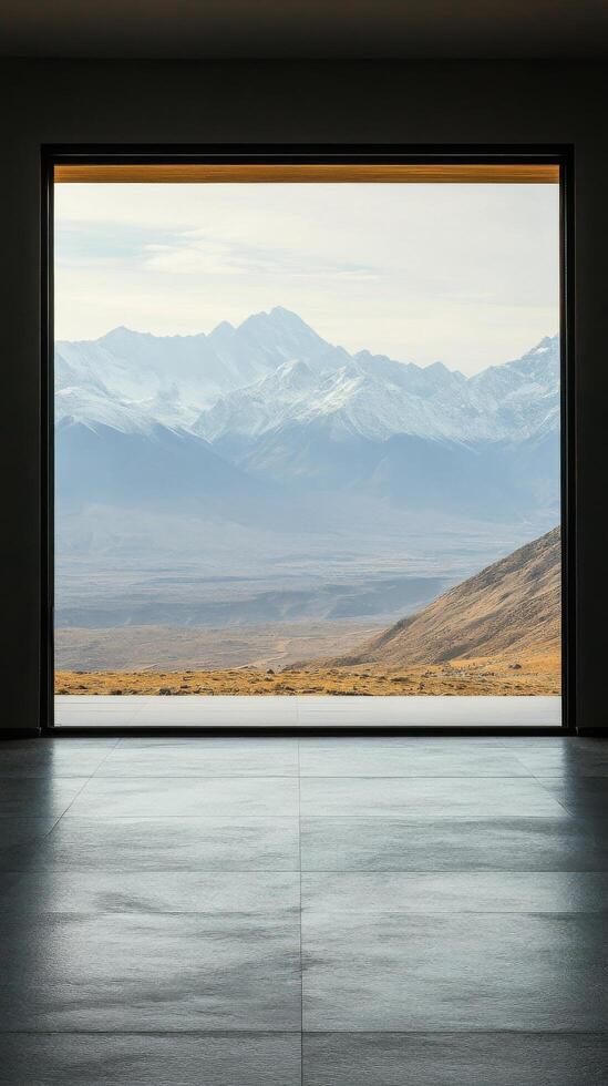 View from an old window showcasing rolling hills and mountains under a clear sky in the morning light photo