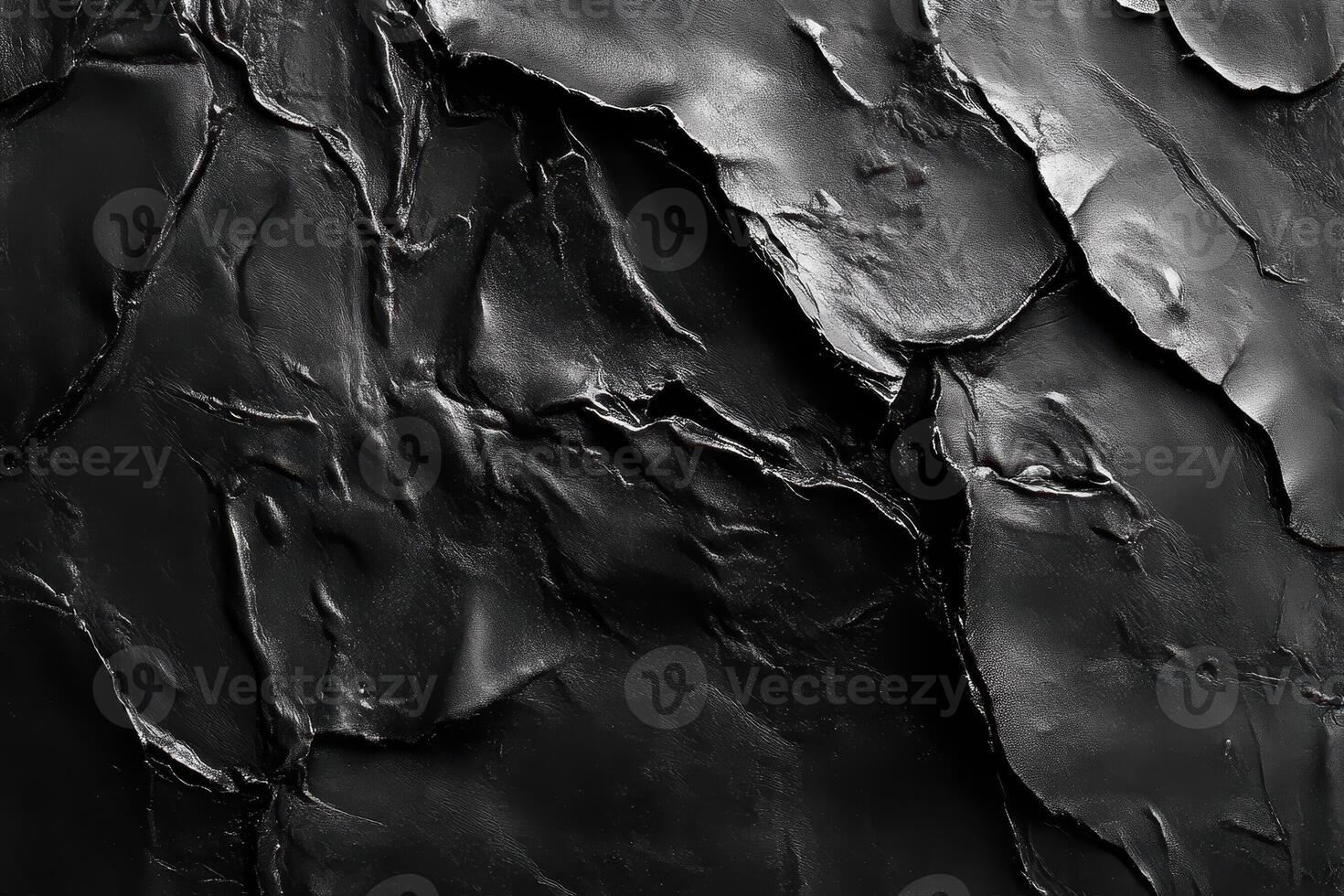 Abstract dark textured material with shadows and light present photo
