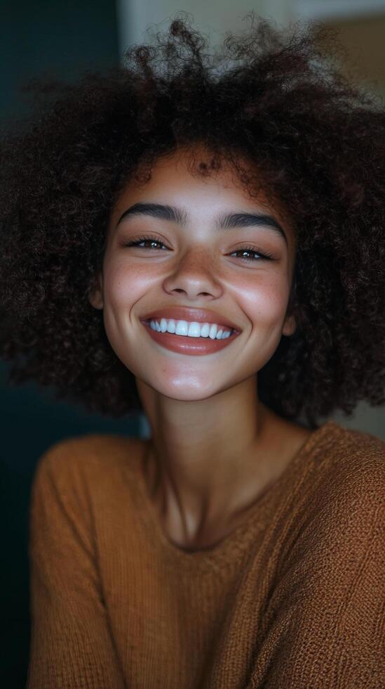 A woman with curly hair smiling photo