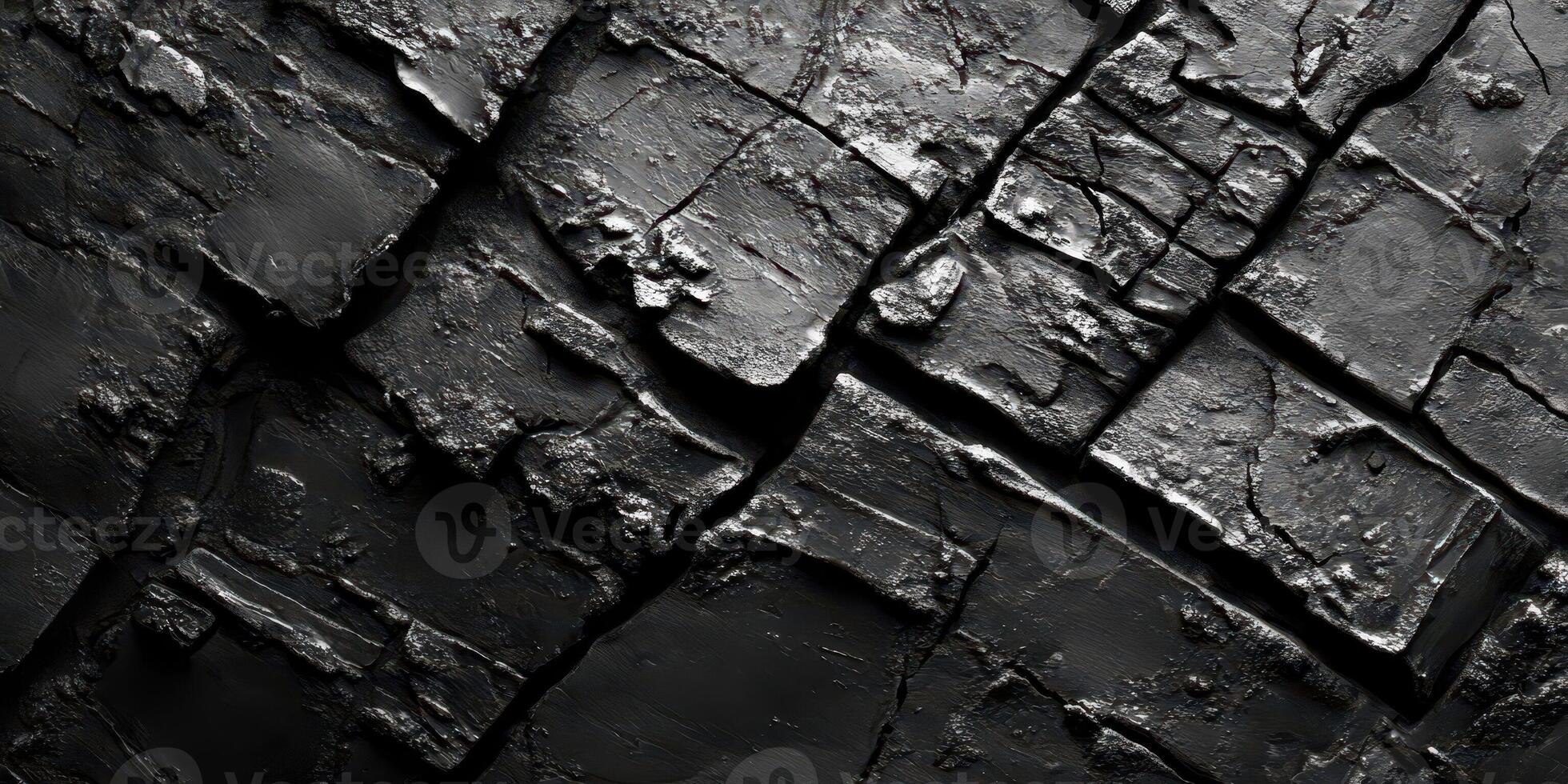 Abstract texture of dark cracked and broken material is shown photo