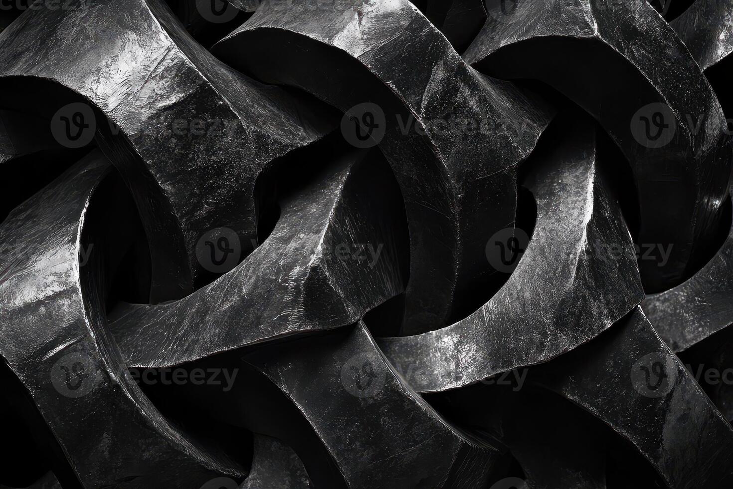 Abstract interlocking metallic forms create a complex dark textured surface photo