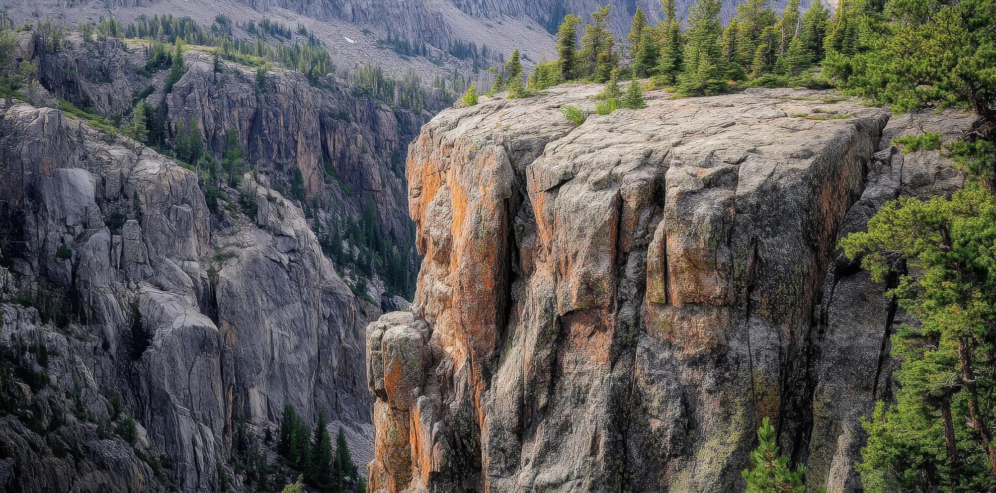 Rocky cliffs covered with green vegetation in a mountainous area photo